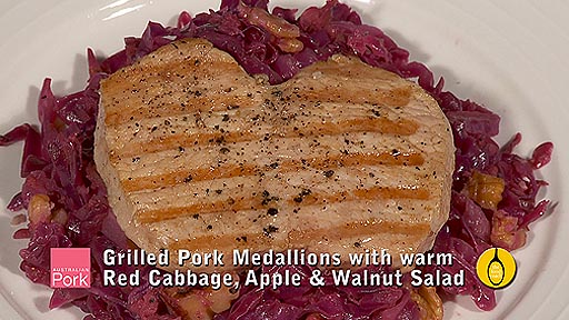 Grilled pork medallions with warm red cabbage, apple and walnut salad