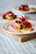 Berry and fruit trifle with pistachio dust